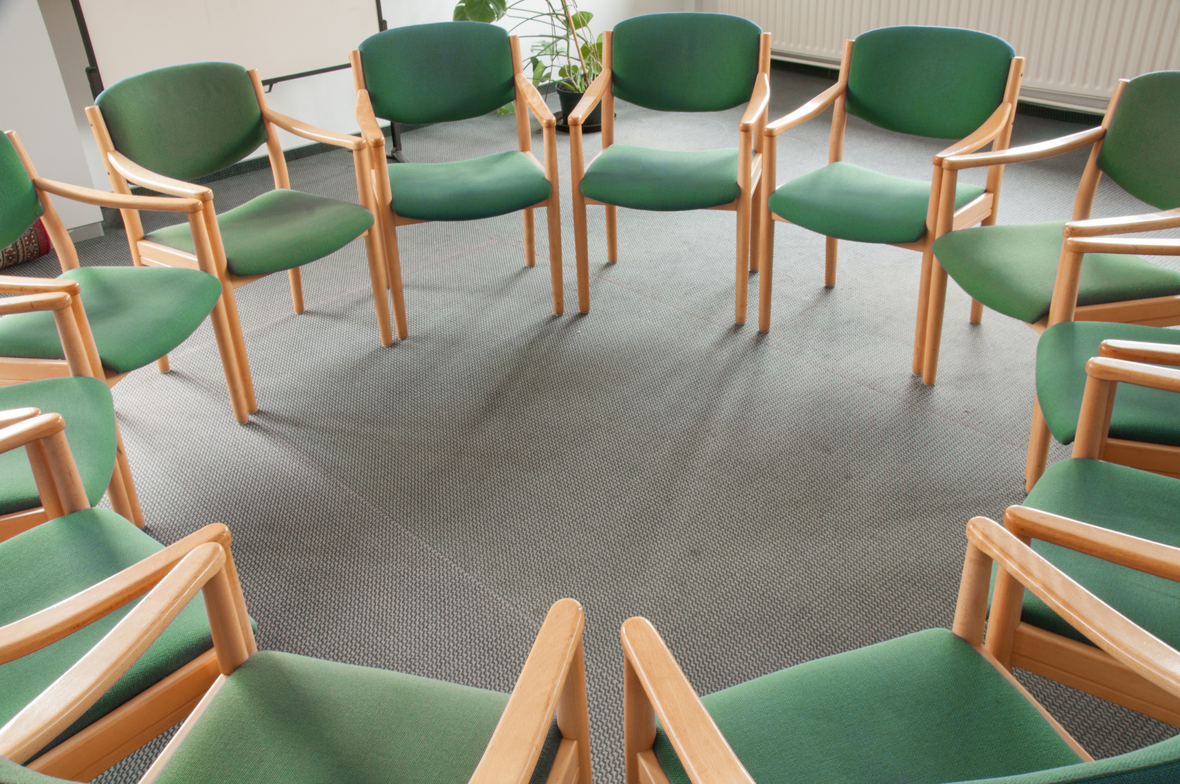 Green chairs in a circle
